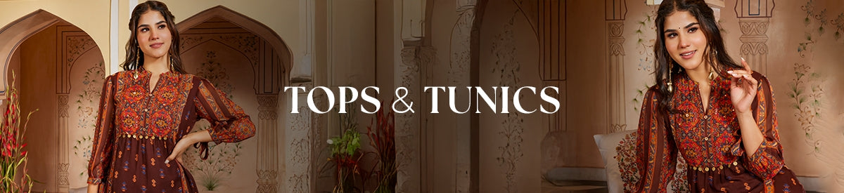 Woman in deep olive green tunic with lace sleeves stands gracefully near a doorway, defining modern casual chic