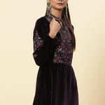 The model showcases the velvet kurta adorned with floral embroidery and shimmering sequin accents from Lakshita