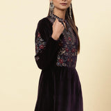 The model showcases the velvet kurta adorned with floral embroidery and shimmering sequin accents from Lakshita