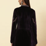 Rear view of the Plum Velvet Flared Tunic with elegant gold dori and sequin accents, modeled by Lakshita