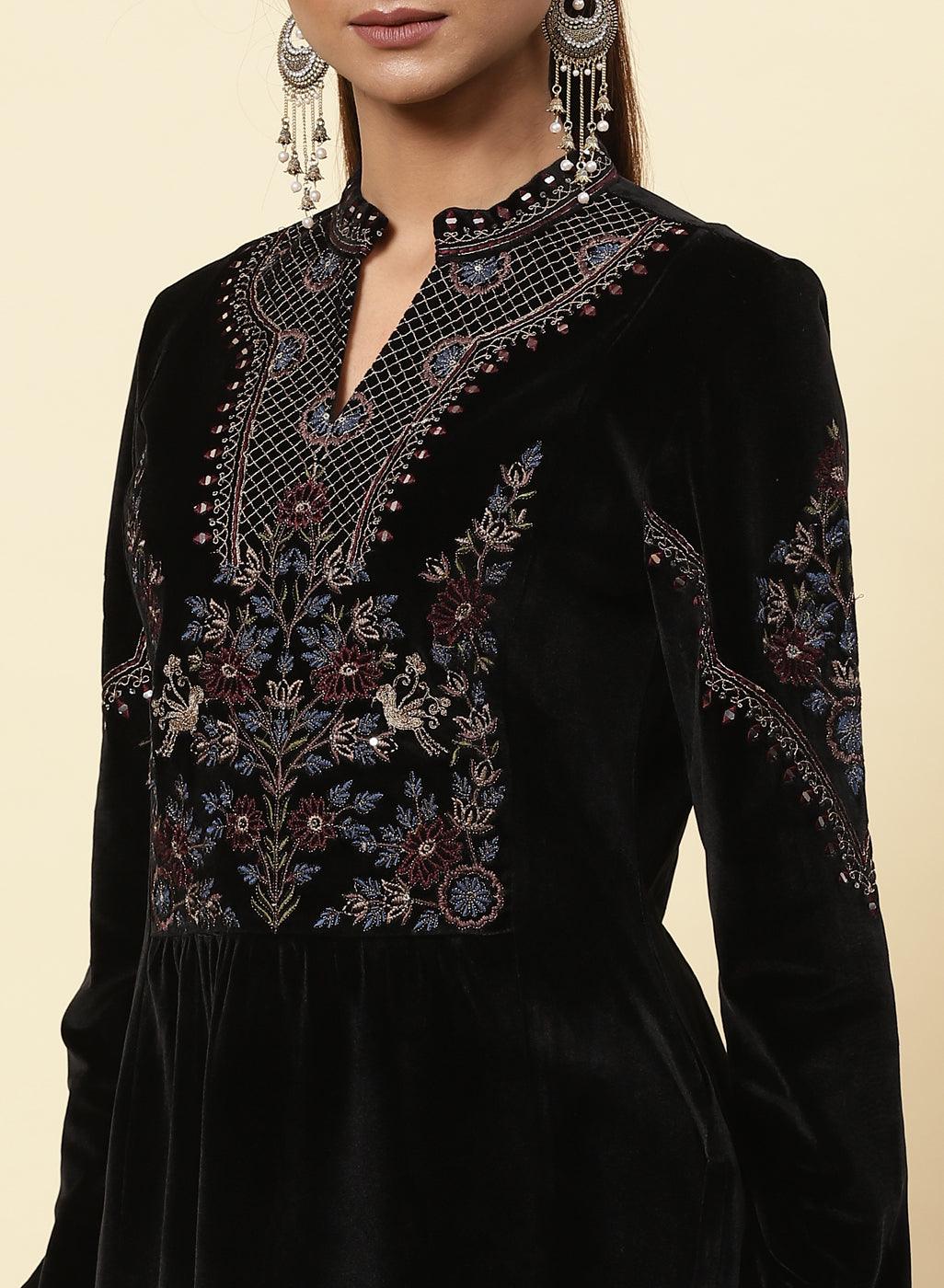The picture of a model wearing a Black Velvet Tunic has been zoomed in.