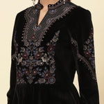 The picture of a model wearing a Black Velvet Tunic has been zoomed in.