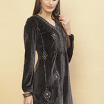 A woman smirking in Slate Grey Embroidered Velvet Tunic With Sequins