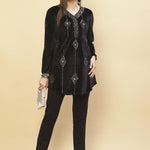 Model pairing Charcoal Black Embroidered Velvet Tunic With Sequins with a silver clutch