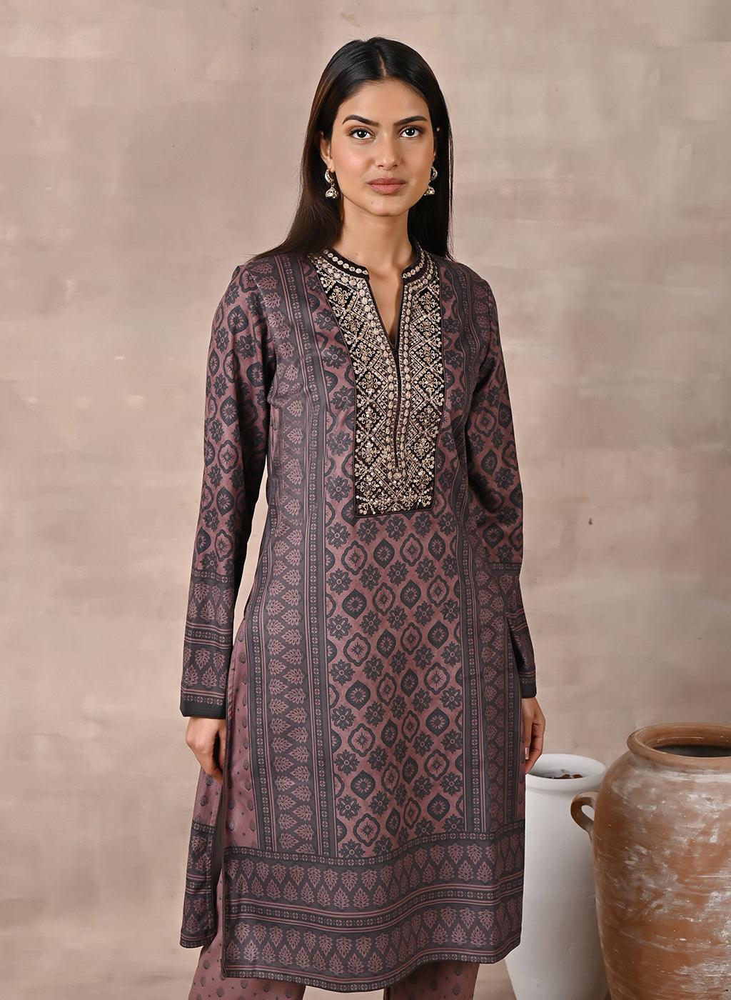 Model smiling in Brown Velvet Kurta Set with Zari & Sequin Work