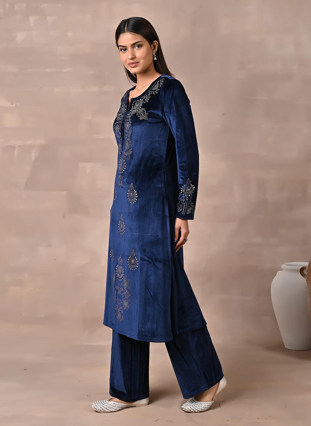 Woman presents the left side of the Navy Blue Velvet Kurta With Fine Mirror Work