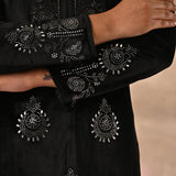 The image presenting the fine mirror work of Black Velvet Kurta by Lakshita Fashion