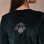 The mirror beads work on the back of Green Velvet Kurta