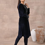 Woman walking sideways in Navy Blue Velvet Kurta with Fine Mirror Beads Work