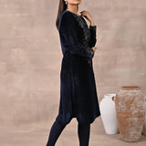 Woman walking sideways in Navy Blue Velvet Kurta with Fine Mirror Beads Work