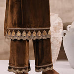 The zoom-in picture shows the lower portion of kurta, trousers and designer footwear
