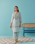 Solid Spa Blue Textured Kurta Set with Schiffli & Lace Work - Lakshita