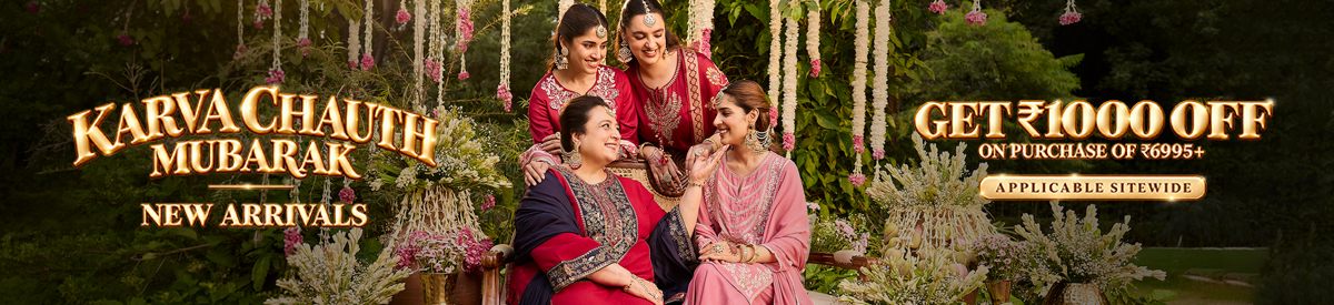 Two women in embroidered purple kurtas sharing a joyful moment while exploring the city – New Arrivals Collection
