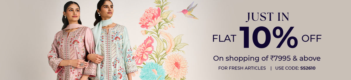 Two women in embroidered purple kurtas sharing a joyful moment while exploring the city – New Arrivals Collection