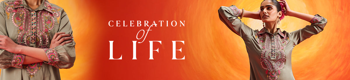 Two women in embroidered purple kurtas sharing a joyful moment while exploring the city – New Arrivals Collection