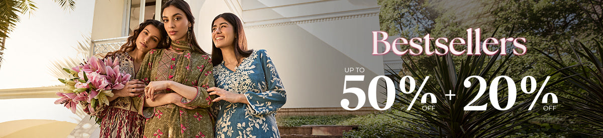 Women in elegant printed co-ords enjoying a relaxed garden picnic – a showcase of this season’s most loved silhouettes