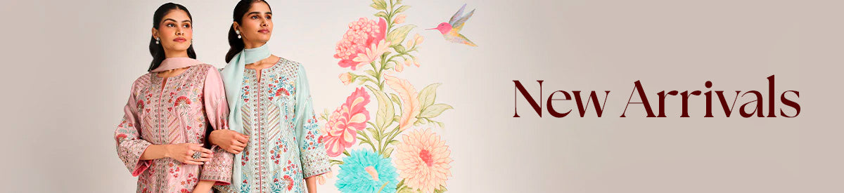 Two women in embroidered purple kurtas sharing a joyful moment while exploring the city – New Arrivals Collection