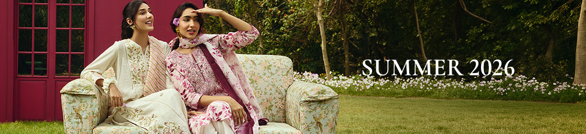 Two women in embroidered purple kurtas sharing a joyful moment while exploring the city – New Arrivals Collection