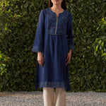 A woman is wearing Navy blue embroidered cotton gauze kurta of Lakshita