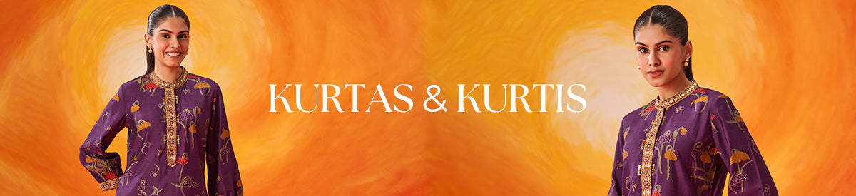 Woman in floral pink kurta sipping a drink beside a bicycle filled with flowers — spotlighting Kurtas & Kurtis collection