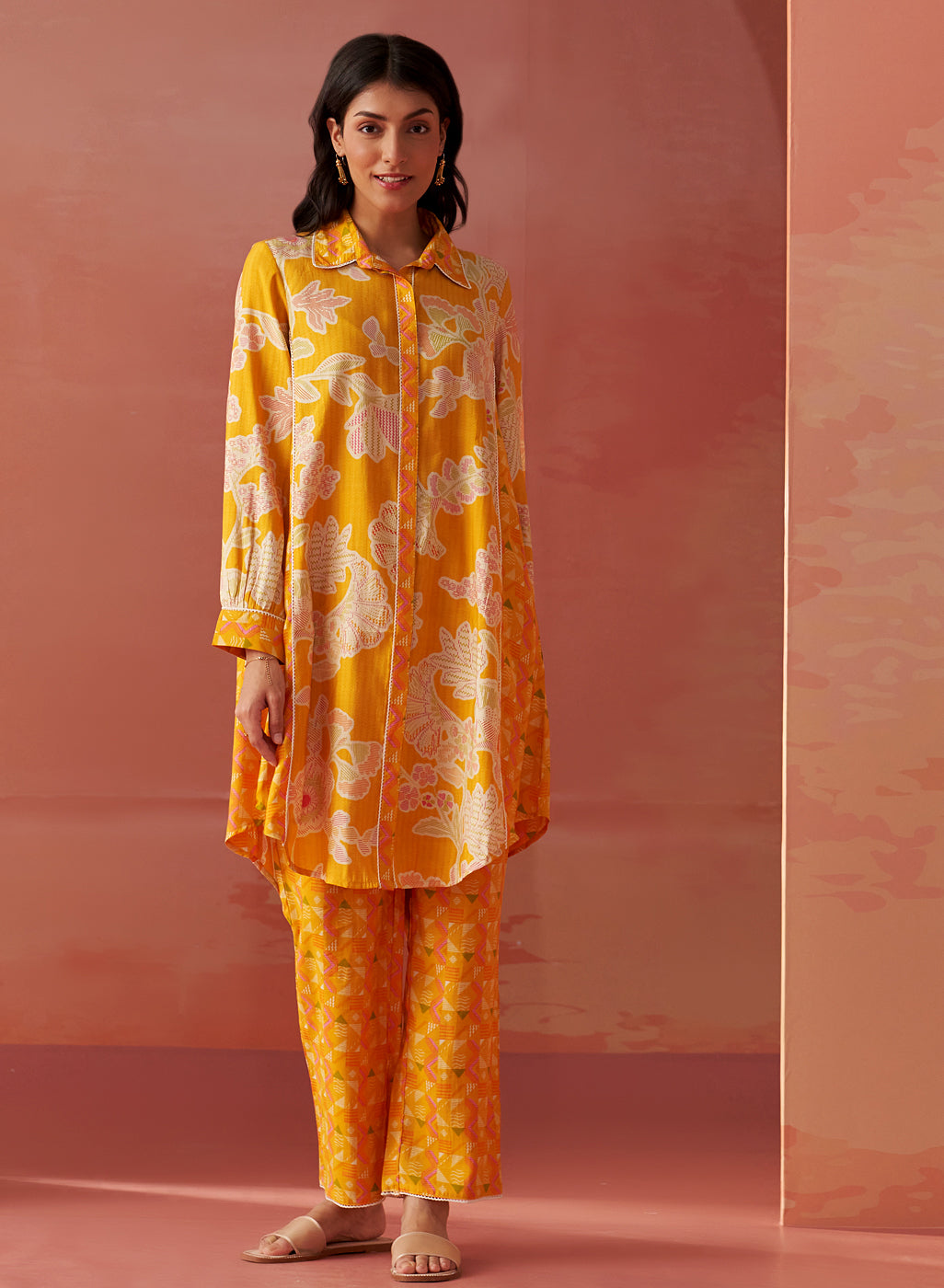 Front view of bright yellow printed Chanderi co-ord set for women featuring floral motifs and a relaxed collared kurta.