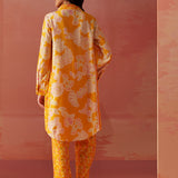 Close-up of Seher bright yellow printed Chanderi co-ord set highlighting floral motifs, collared neckline, and sleeve detail.