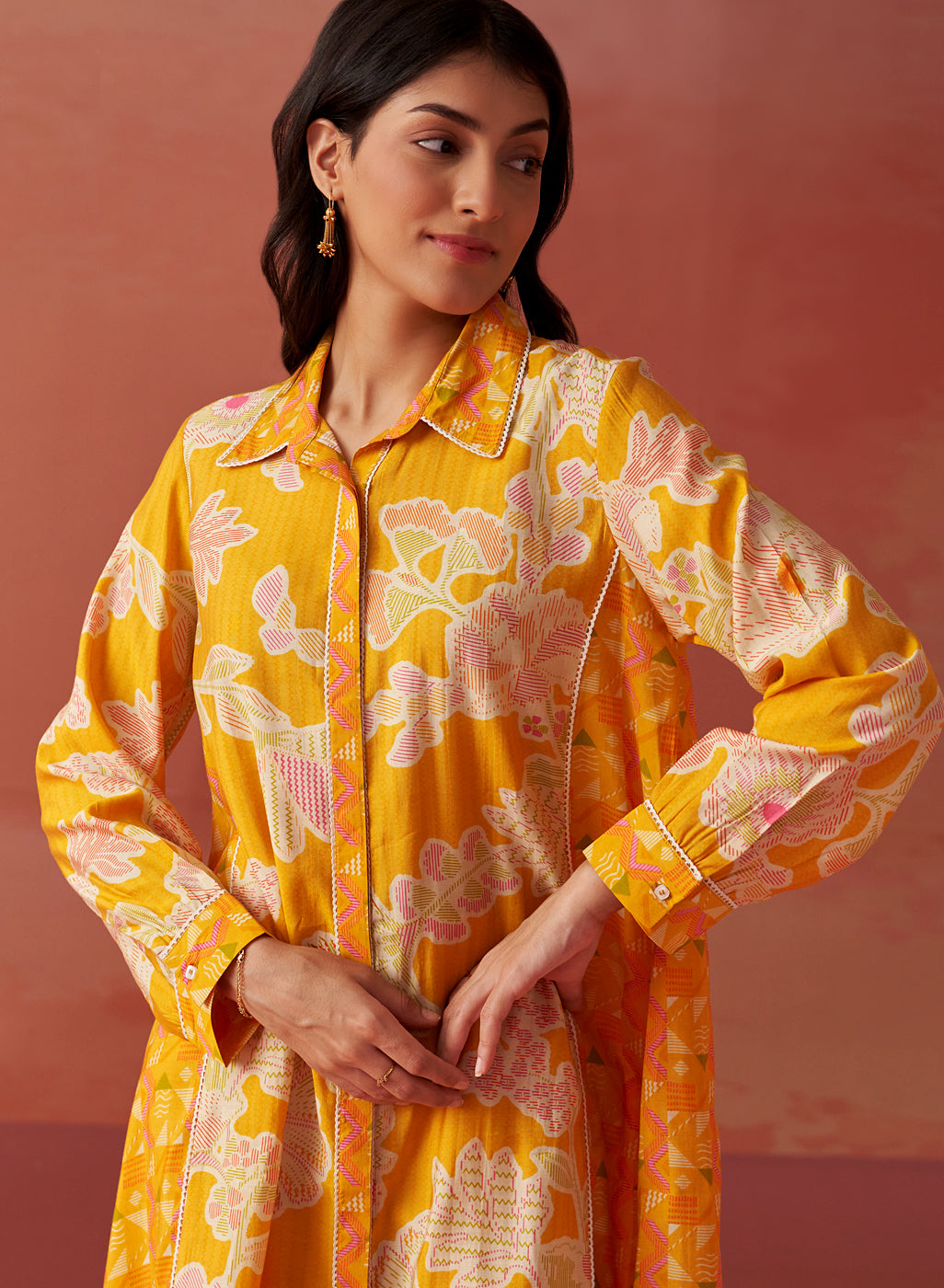 Close-up of Seher bright yellow printed Chanderi co-ord set highlighting floral motifs, collared neckline, and sleeve detail.