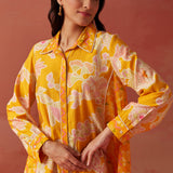 Close-up of Seher bright yellow printed Chanderi co-ord set highlighting floral motifs, collared neckline, and sleeve detail.