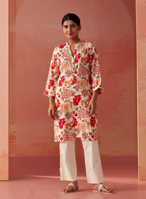 Model wearing Yasmin Fuschia Printed Rayon Kurti for women, highlighting the elegant, vibrant design and flattering fit.