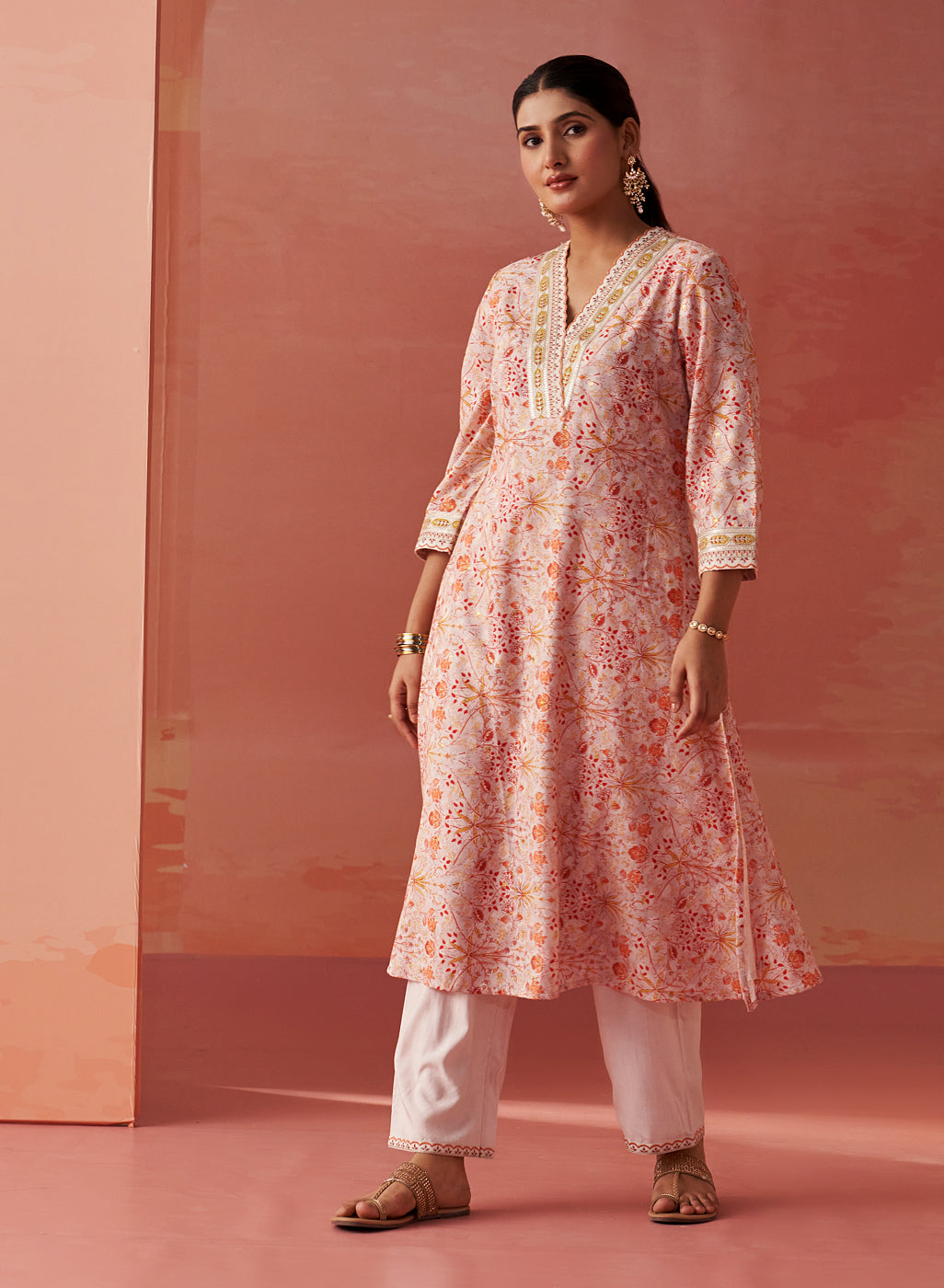 The model adds flair to Lakshita’s Rumaisa Chanderi Jacquard Co-ord Set in vibrant orange print