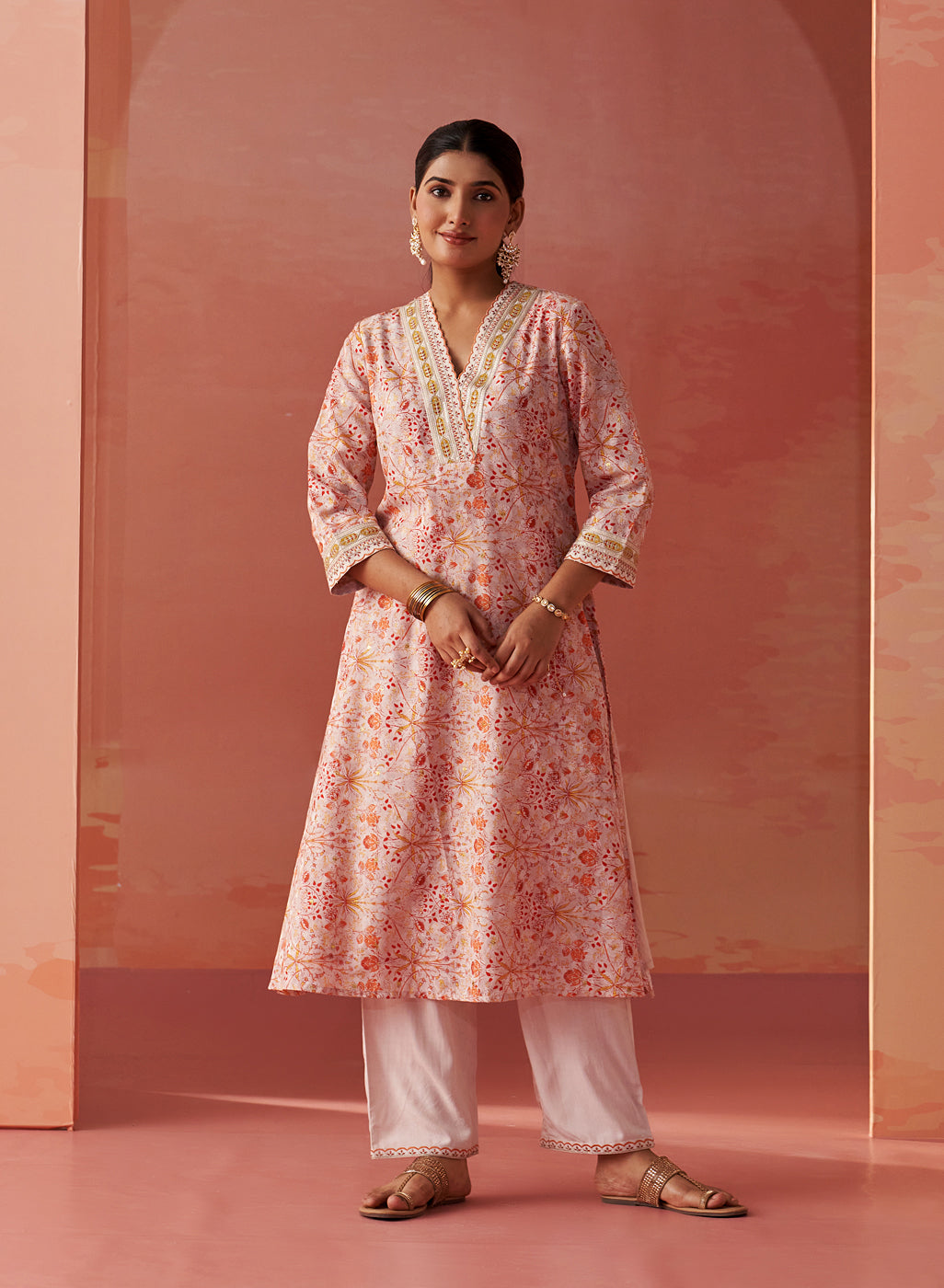 The model is styled in Lakshita's vibrant Rumaisa Orange Printed Chanderi Jacquard Co-ord Set