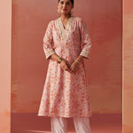 The model is styled in Lakshita's vibrant Rumaisa Orange Printed Chanderi Jacquard Co-ord Set