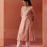 Dressed in Lakshita’s Rumaisa Co-ord Set, the model stuns in vibrant orange Chanderi Jacquard