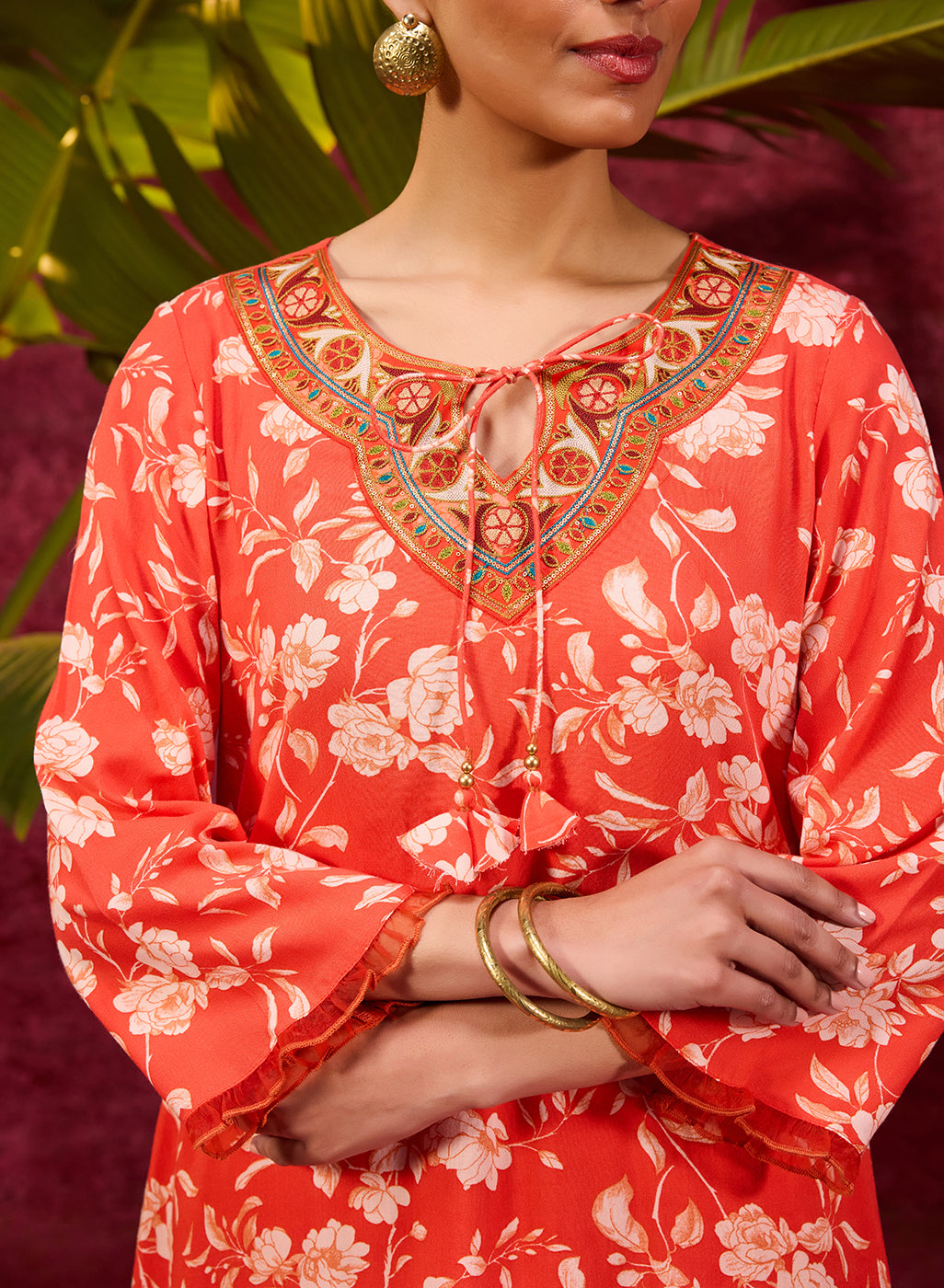Thready embroidery on the neck of orange rayon printed kurta set for women