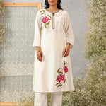 Lakshita Ulfat Ivory Kurta Set in front view showing elegant pink floral motifs on one chest side and hemline.
