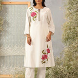 Lakshita Ulfat Ivory Kurta Set in front view showing elegant pink floral motifs on one chest side and hemline.