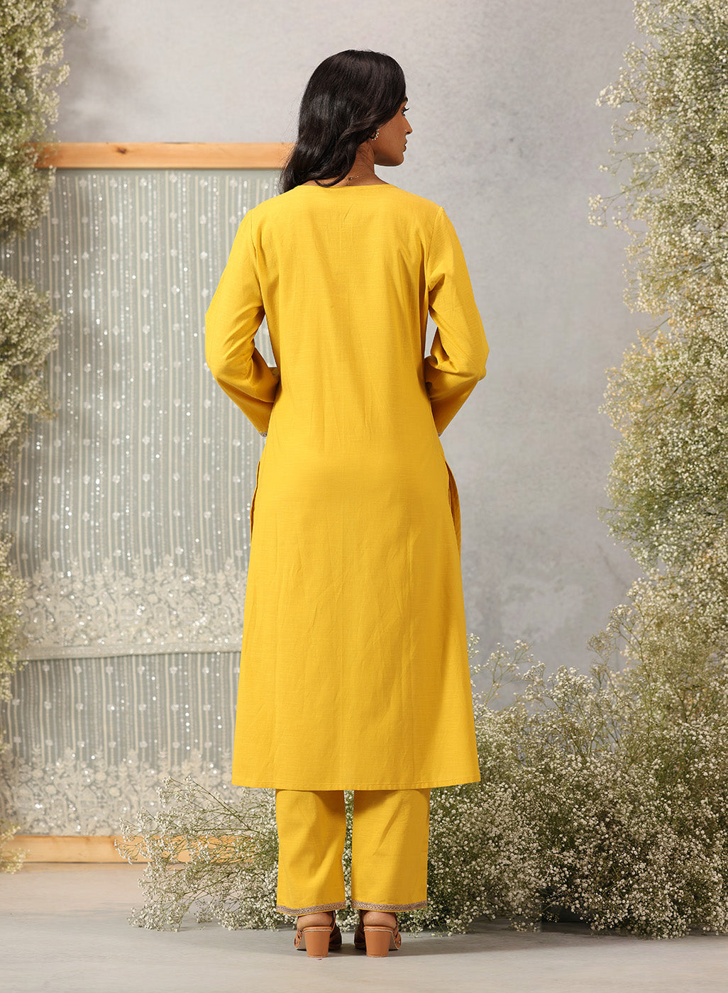Back view of Lakshita Ulfat Sunflower Yellow Kurta Set showing plain cotton linen fabric with solid colour and straight cut.