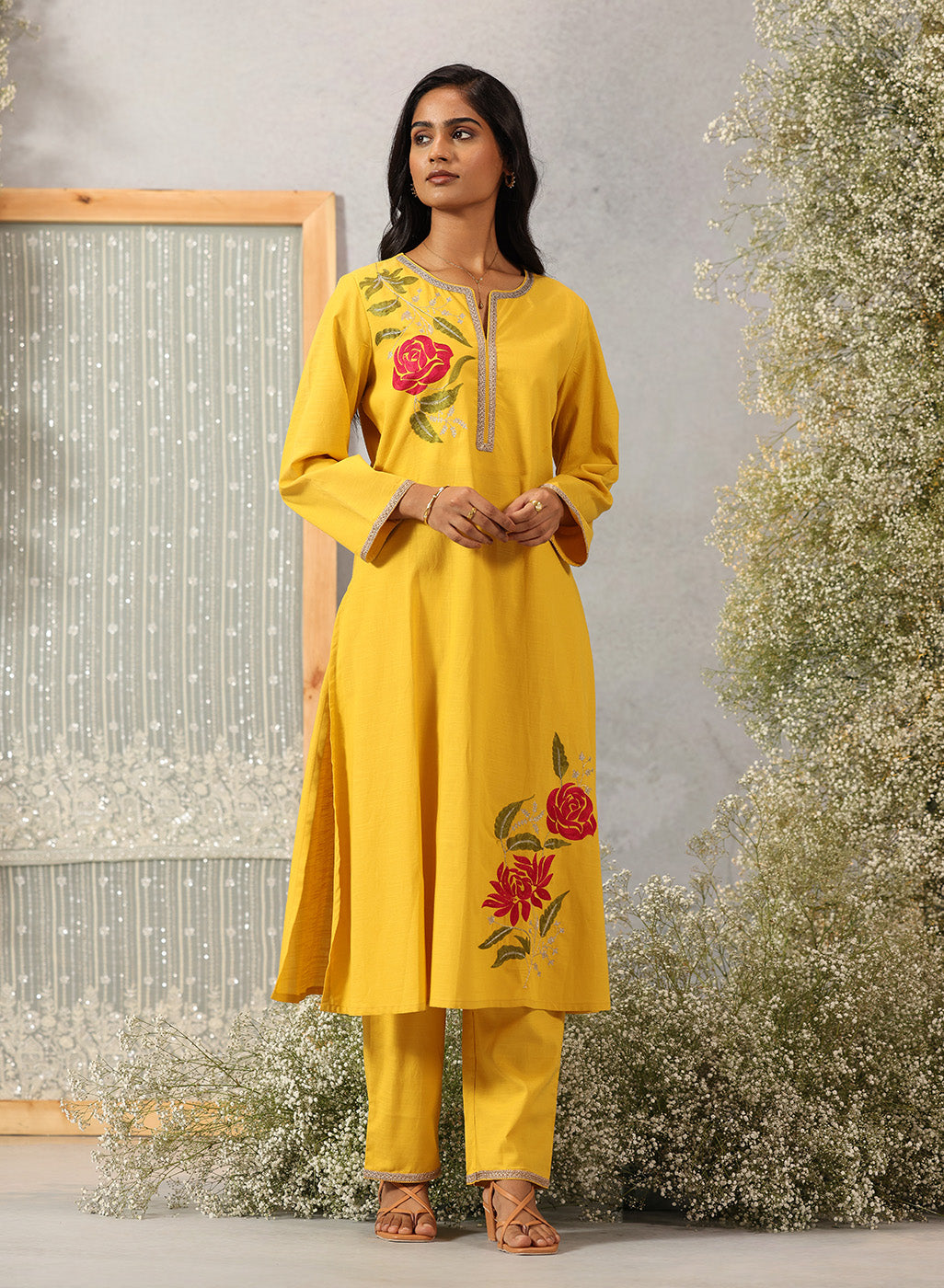 Model in Ulfat Sunflower Yellow Cotton Linen Kurta Set by Lakshita with zari embroidered kurta and straight-fit pants.
