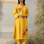 Model in Ulfat Sunflower Yellow Cotton Linen Kurta Set by Lakshita with zari embroidered kurta and straight-fit pants.