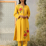 Model in Ulfat Sunflower Yellow Cotton Linen Kurta Set by Lakshita with zari embroidered kurta and straight-fit pants.