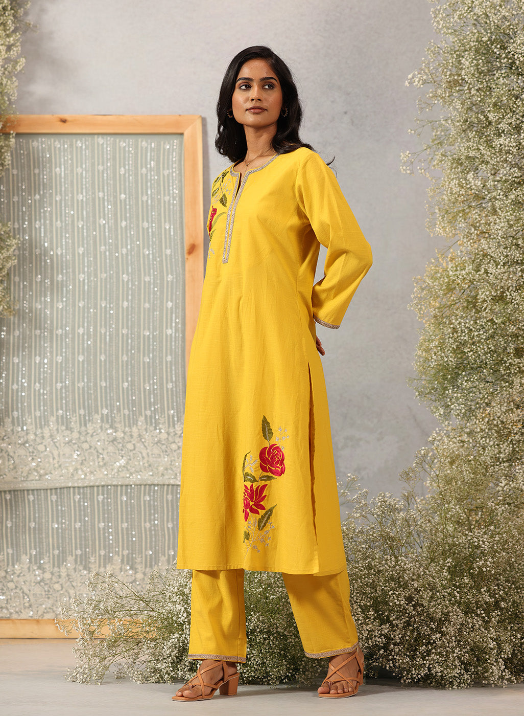 Sunflower Yellow embroidered kurta set by Lakshita shown in full front view with straight silhouette and solid pants.