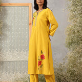 Sunflower Yellow embroidered kurta set by Lakshita shown in full front view with straight silhouette and solid pants.