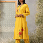 Lakshita Ulfat Sunflower Yellow Kurta Set showing front-side profile with silk thread motifs, zari lace trims.