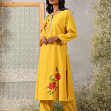 Lakshita Ulfat Sunflower Yellow Kurta Set showing front-side profile with silk thread motifs, zari lace trims.