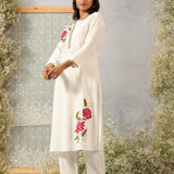 Model in Lakshita Ulfat Ivory Kurta Set with detailed rose threadwork along the hemline, captured in a full-body front shot.
