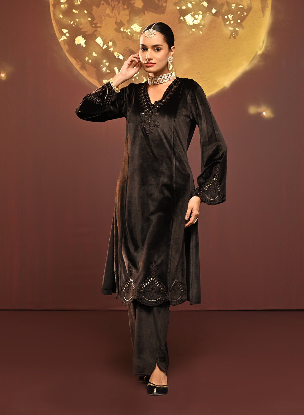 Woman making a dance move in Sadia Brown Embroidered Velvet Co-ord Set