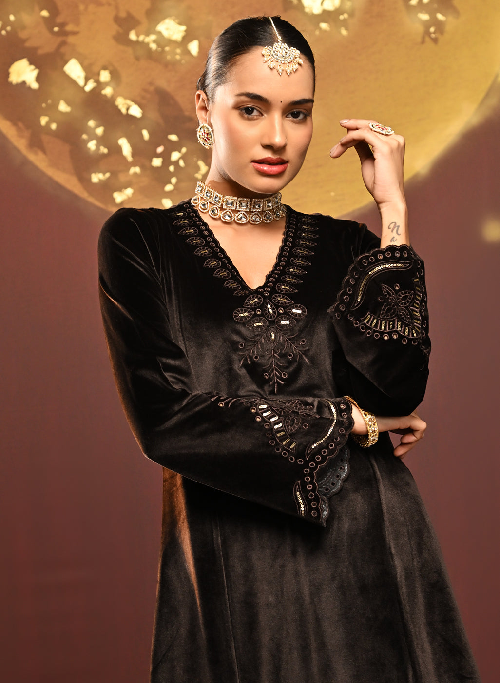 Woman showcasing the top of the Sadia Brown Embroidered Velvet Co-ord Set