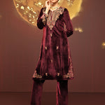 A model poses in Mayal Maroon Embroidered Velvet Kurta Set
