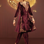 The model flaunting Mayal Maroon Embroidered Velvet Kurta Set