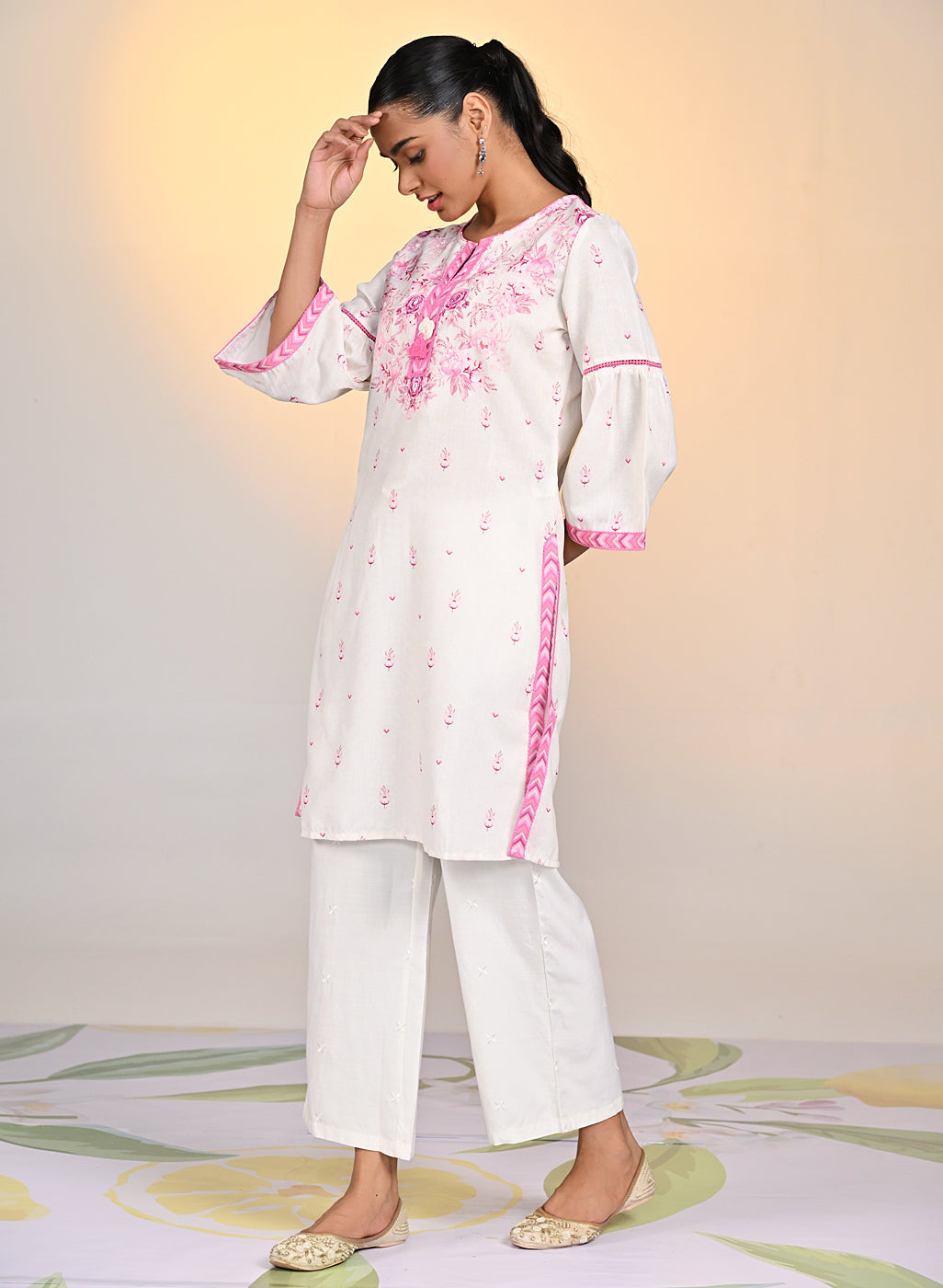 Model wearing Gulshan Ivory Fuschia Printed Cotton Linen Kurta from Lakshita, highlighting the vibrant and elegant print.